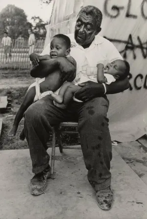 Untitled [A grandfather holds his two grandchildren in Resurrection City, Washington D.C.]